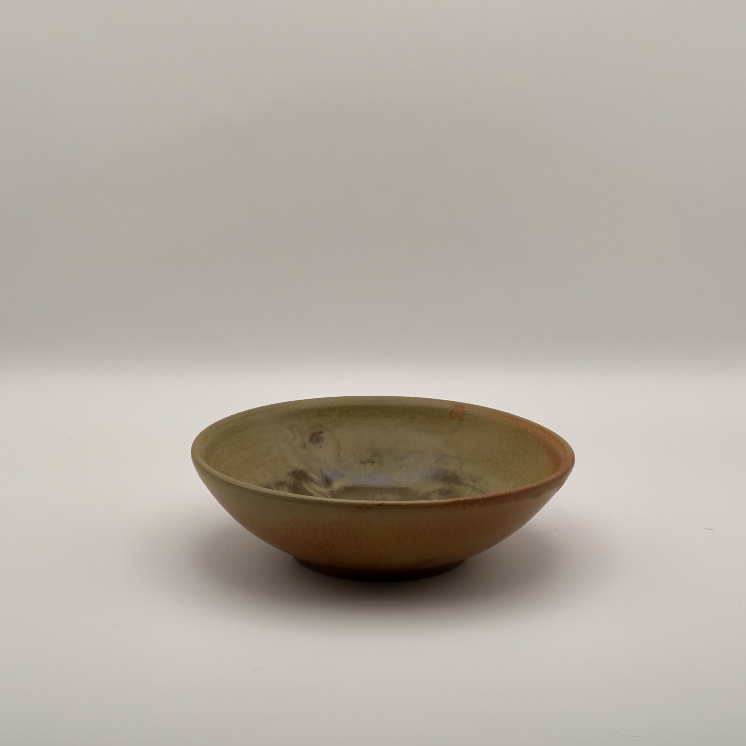 Amber bowl with a white drip glaze