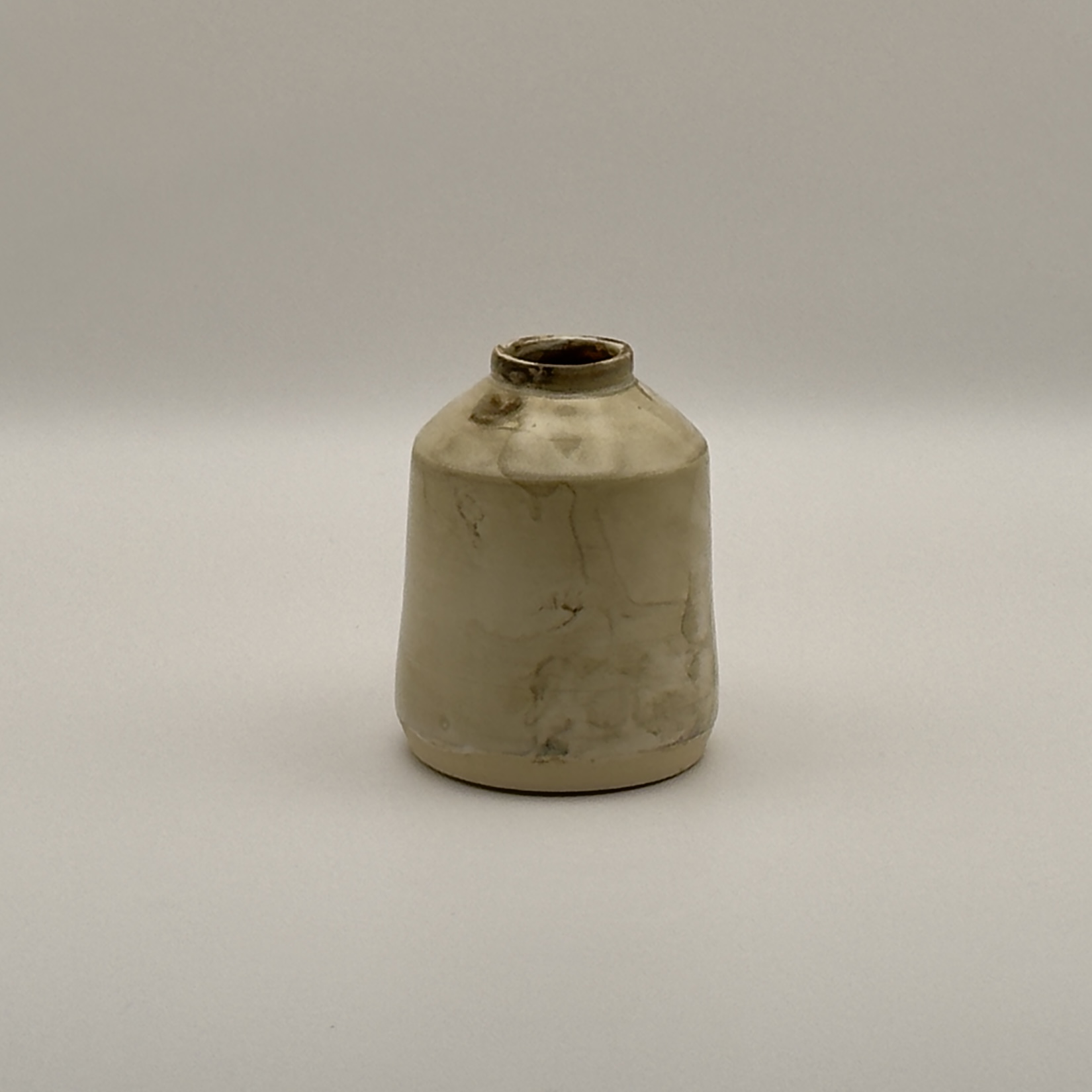 Small cream vase with a crackled, drippy glaze