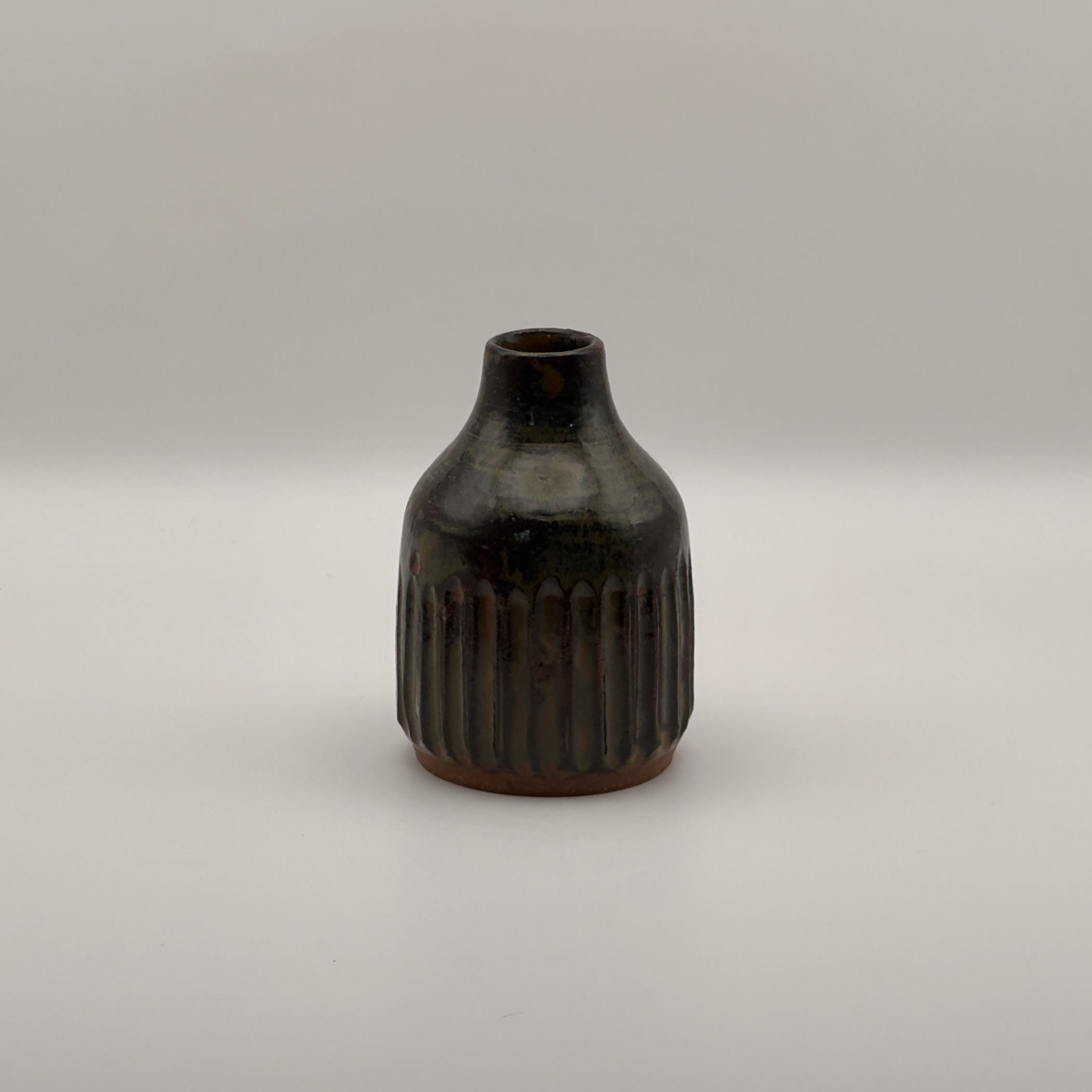 Dark brown ribbed bud vase