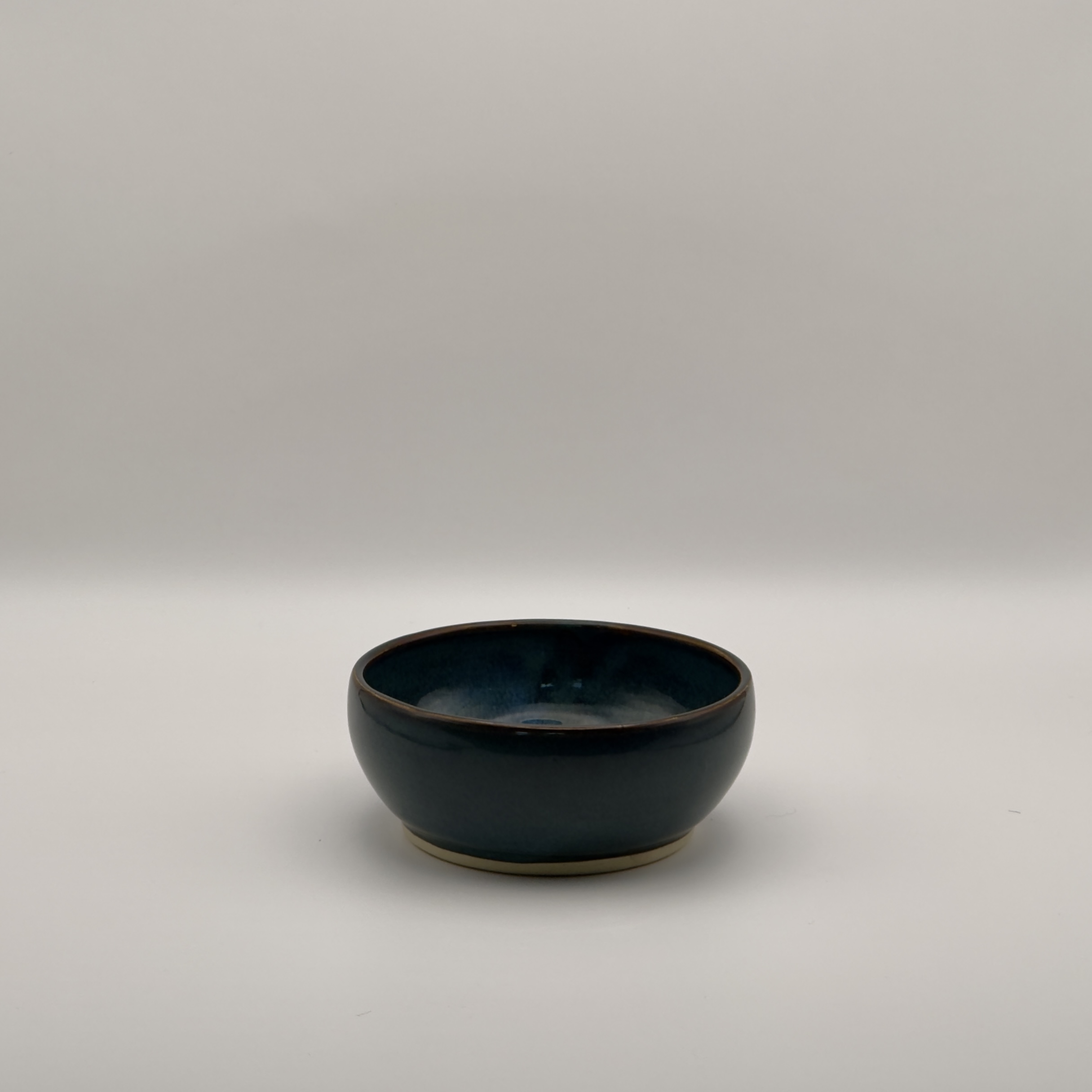 Small navy blue glazed bowl