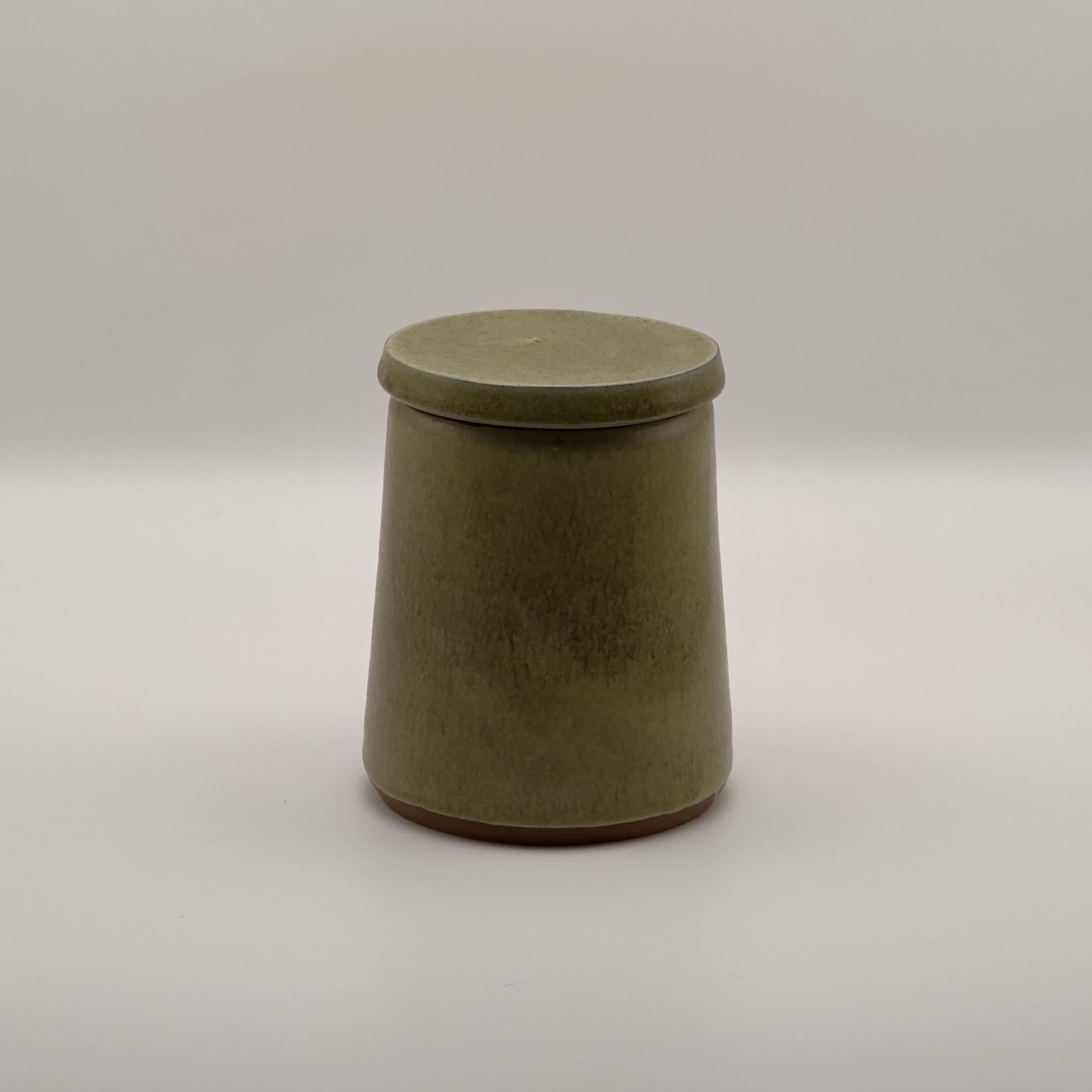 Olive green lidded storage jar