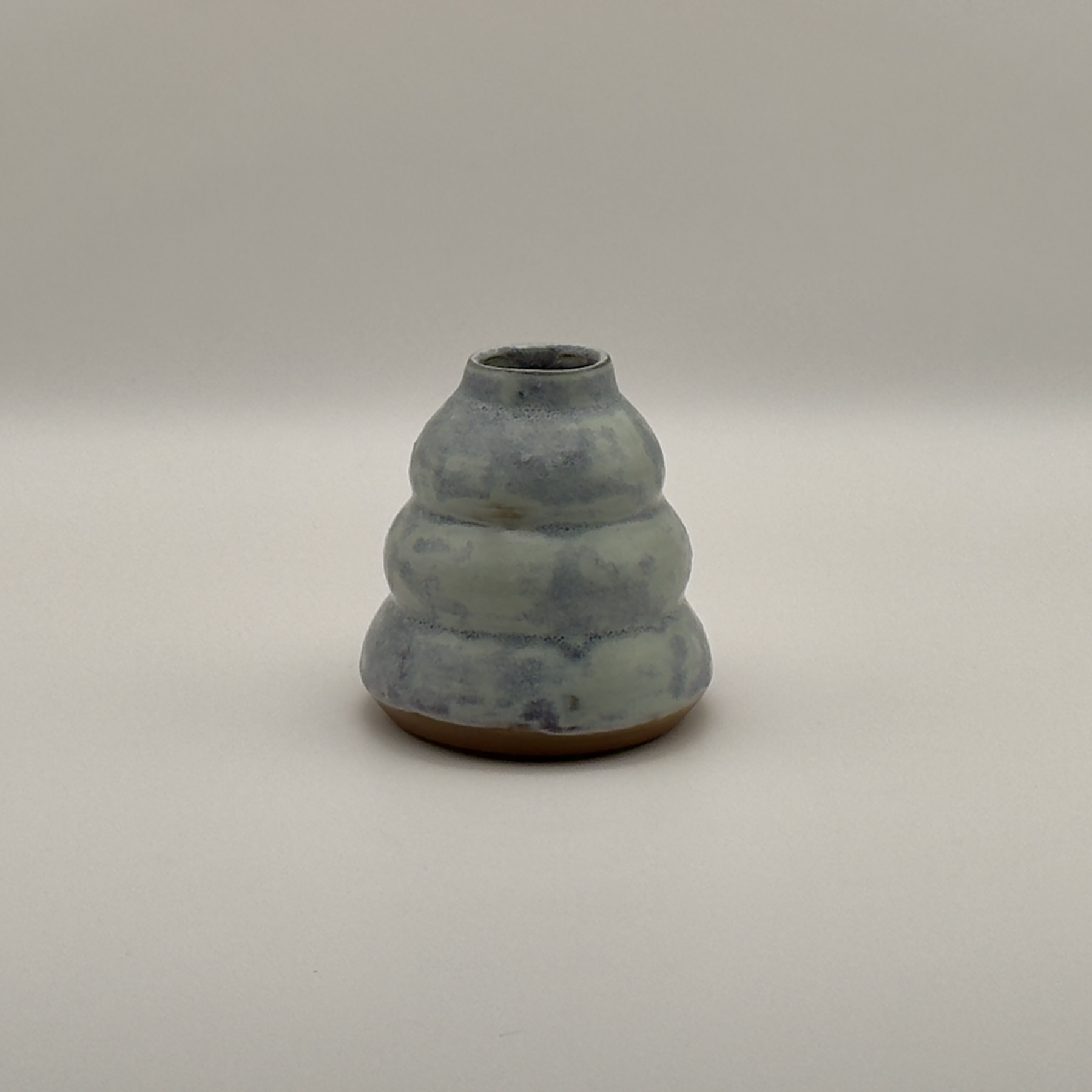 Pale blue tiered, stacked-bulb vase