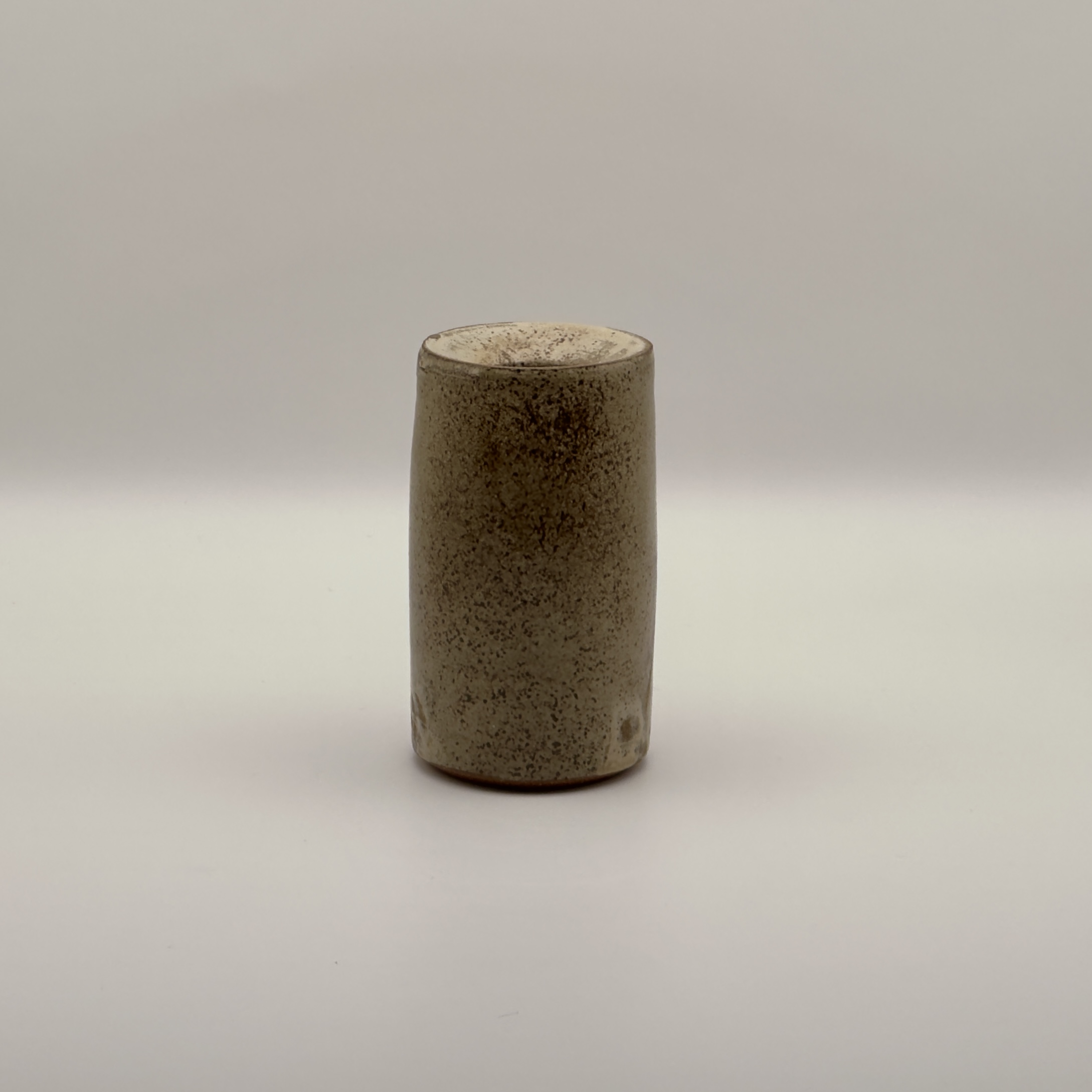 Tall tan speckled cylinder vase